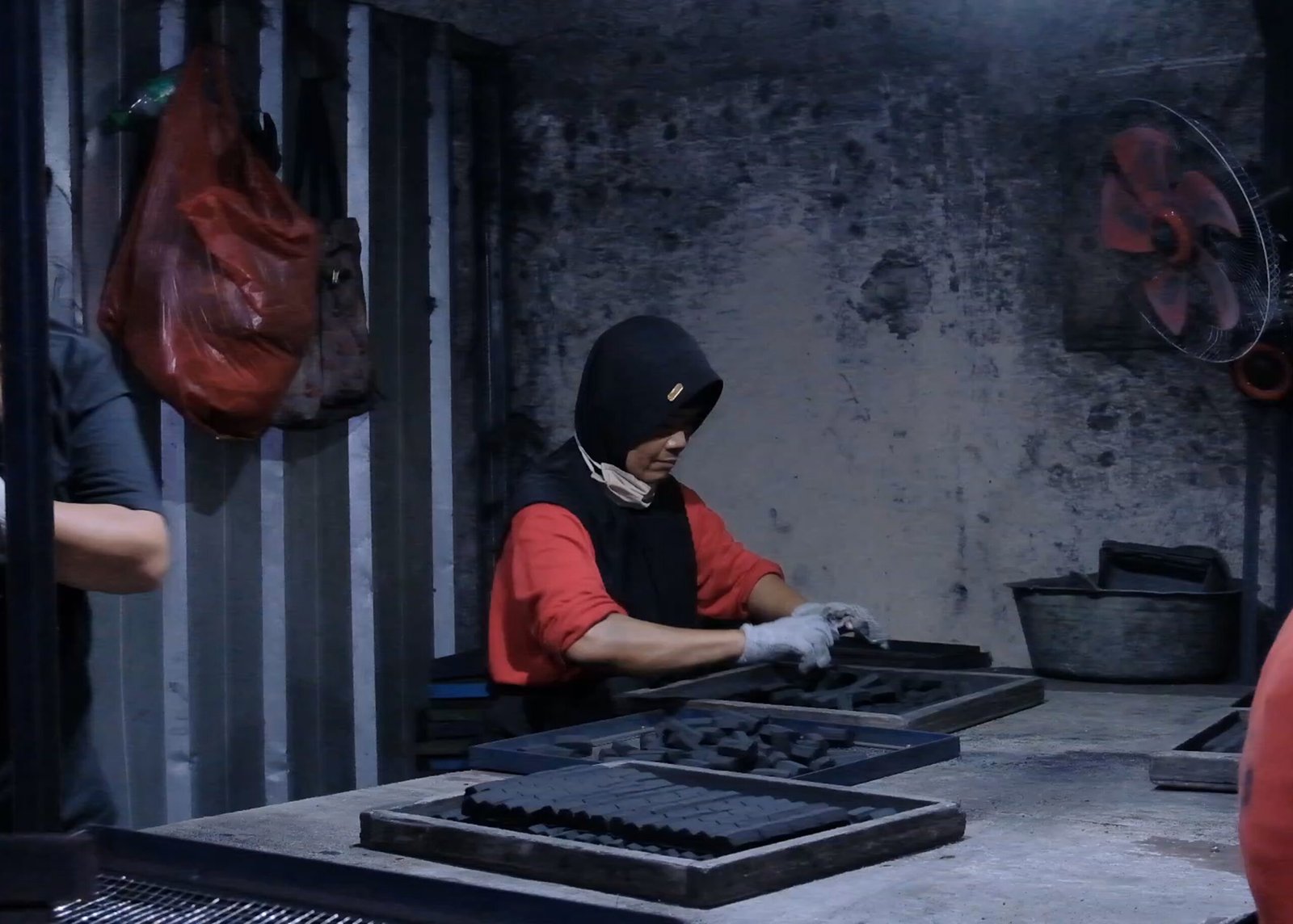 Stacked coconut charcoal briquettes at the factory